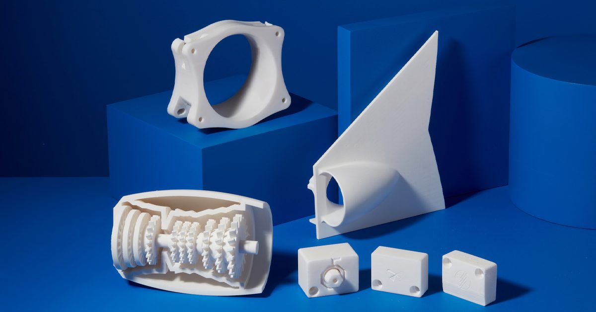 3D-printed items displayed on a surface, showcasing detailed, rigid components produced with 10K resolution printing – a hero image highlighting precision and quality.
